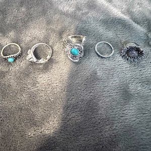 Assorted silver tone and turquoise rings
